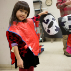 A young girl making art at the Brooklyn Museum