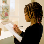 A girl drawing in the Brooklyn Museum galleries